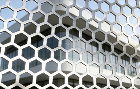 Aluminum perforated sheet 1/16 inch thick with 1/8 inch hexagonal holes for architectural wall cladding and air passage